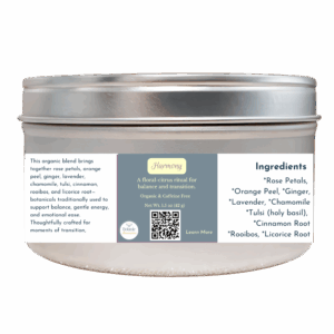 Harmony organic herbal tea in a silver tin with a soft blue-gray label, a floral-citrus blend designed to support balance and gentle transition.