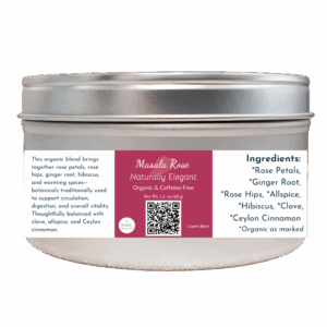 Masala Rose organic herbal tea in a silver tin with a rose-colored label, blending rose petals, warming spices, and hibiscus for circulation and vitality.